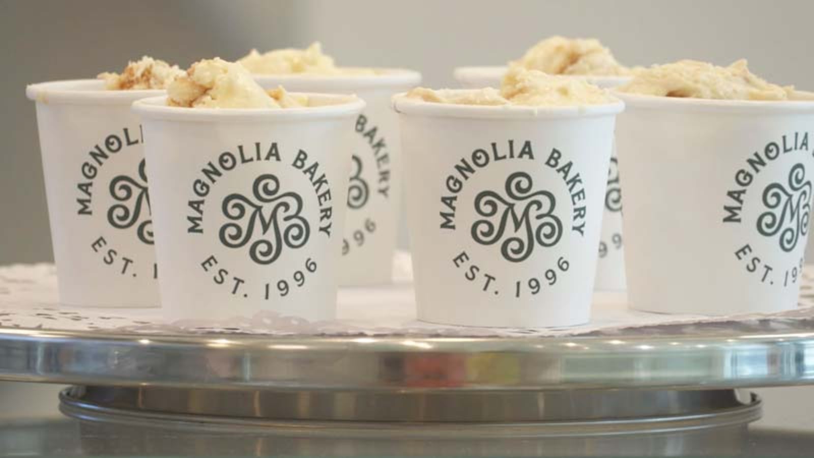 Cups of Magnolia Bakery banana pudding on a silver stand