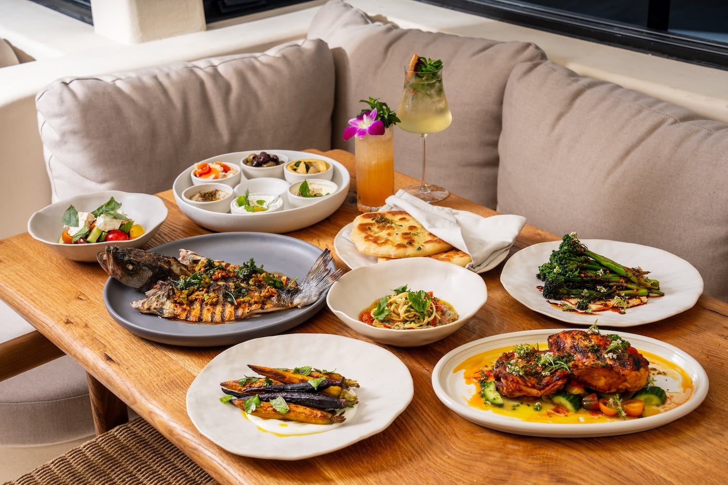 A Mediterranean seafood and pasta spread at By The Sea in Coronado